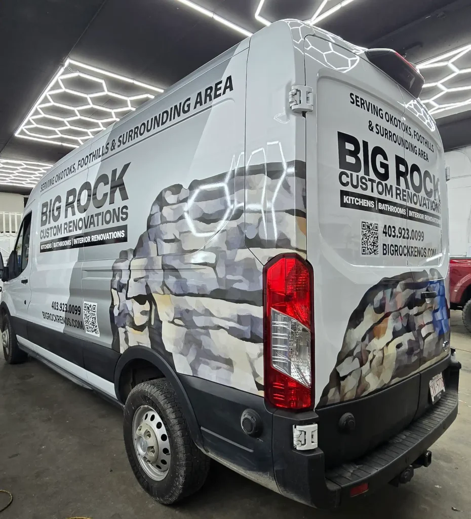 Custom stickers Okotoks displayed on a van promoting a renovations company